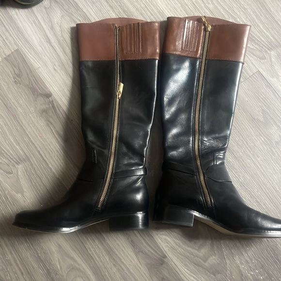 Michael Kors black riding boots with brown trip at top. - Picture 2 of 2